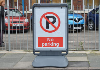 Advocate™ poster display sign in car park with ‘no parking’ display