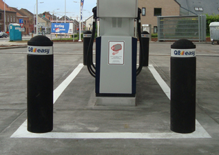 Buffer™ Bollard flexible marker post in black with white banding by petrol pumps