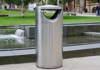 Centrum™ Litter Bin in stainless steel modern finish in front of water feature in city centre