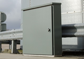 Citadel™ IP Rated Enclosure for electrical storage in metal with locking door, placed in front of railing