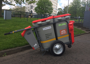 Double Space-Liner™ litter transporter outside a residential housing block