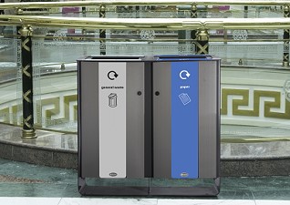 Electra™ Indoor Recycling Bins for general waste and paper next to golden staircase in shopping centre