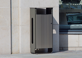 Electra™ Outdoor Litter Bin in stainless steel sited next to modern building
