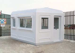 Genesis™ GRP Modular Kiosk in white with windows and door, sited on private business premises