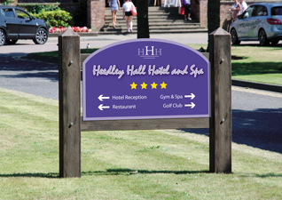 Glasdon Gateway Site Entrance Sign with dark wood posts and purple sign