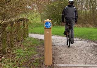 Glenwood™ 170 signhead post in a light wood effect on cycle path