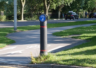 Mini-Ensign™ bollard with sign carrying face for cycle path