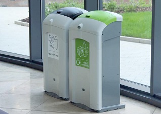 Nexus® 100 indoor recycling bins for general waste and mixed recyclables with flip lids inside building