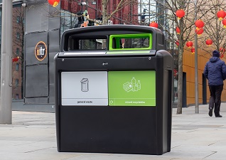 Nexus® Evolution City Duo Recycling Bin for general waste and mixed recyclables next to shops