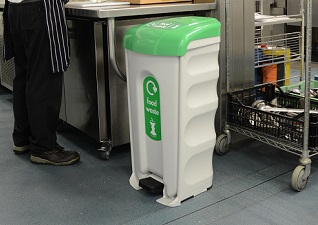 Nexus® Shuttle catering pedal bin for food waste with green lid in commercial kitchen