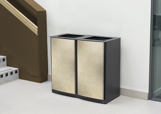 Nexus® Style Duo 170 Litre Indoor Recycling Bin with gold vinyl wrap by modern staircase in contemporary office building