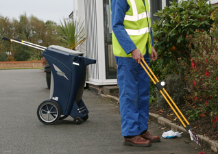 Skipper™ Orderly Barrow in dark blue used by man who is collecting litter