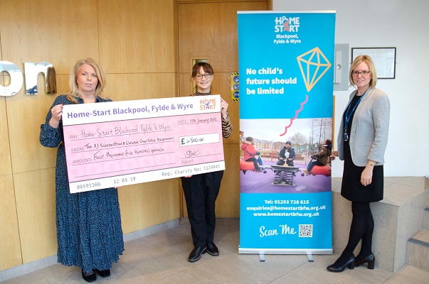 Members of Glasdon handing over donation to Home-Start