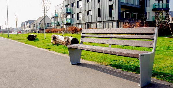 Vistra Seat fixed beside a grass verge in a modern architectural area